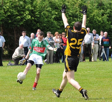 Paddy Gahan kicks a great point against L'Bridge in the IFC on 19-7-09 in front of the admiring Clonmore supporters.